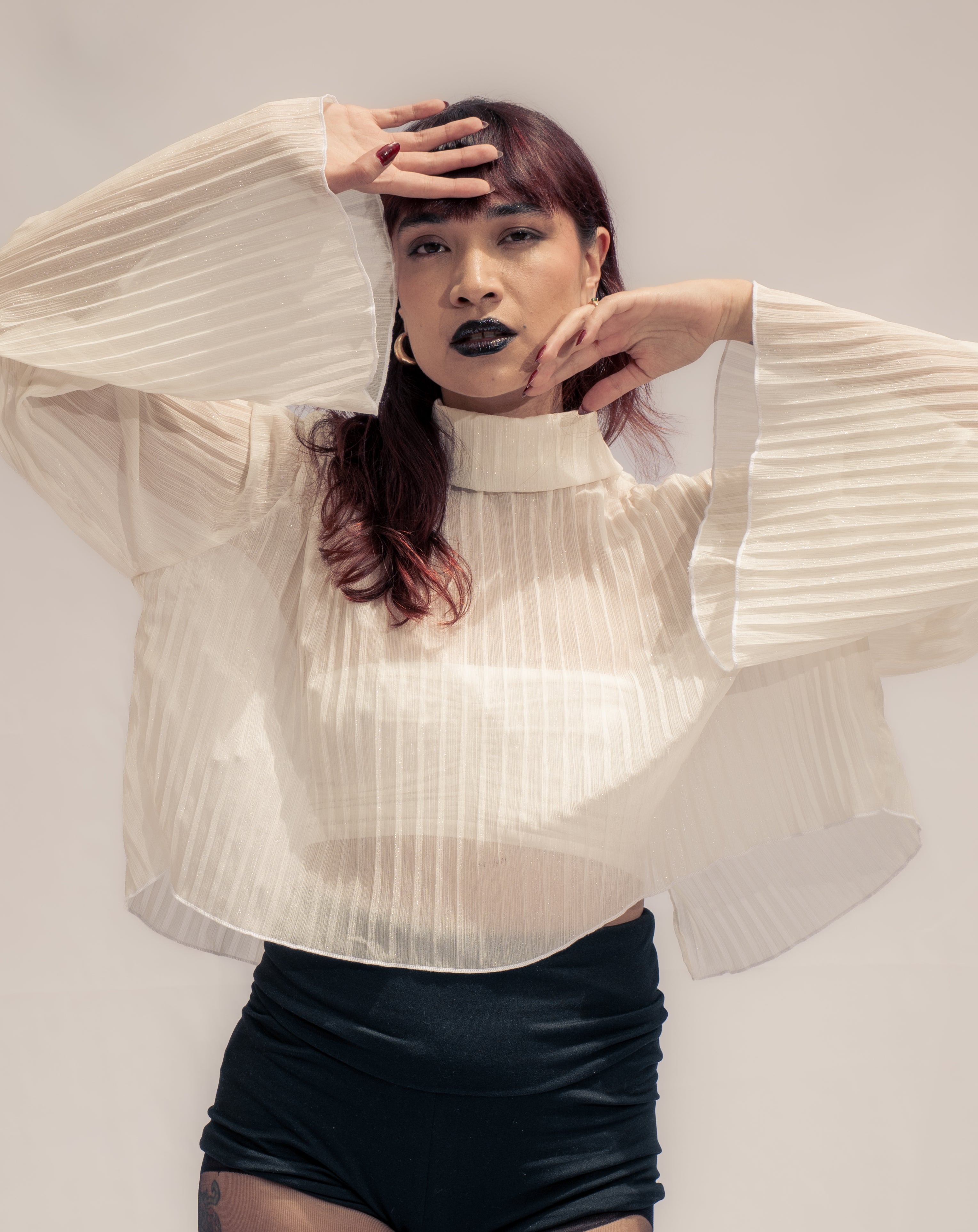 Gilded pleated top