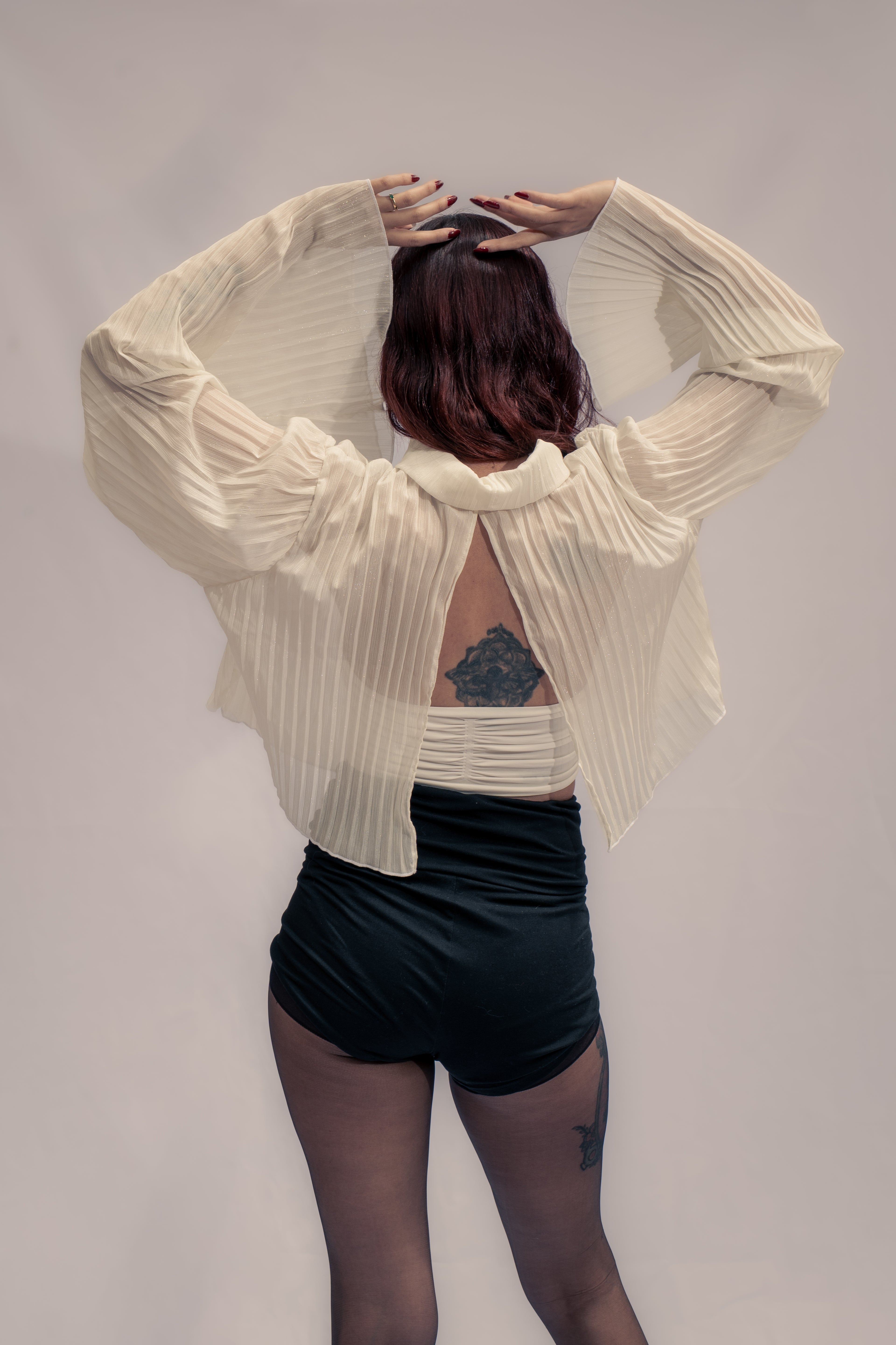 Gilded pleated top